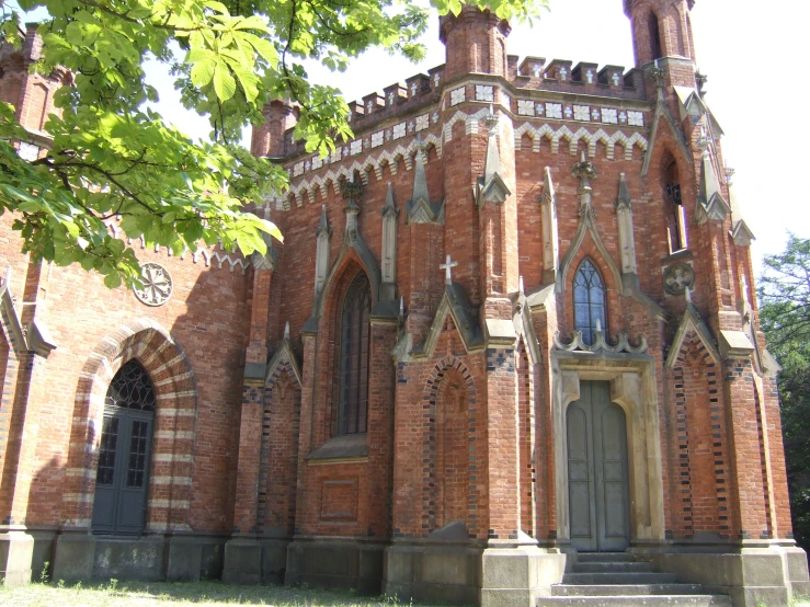 an old church building is surrounded by trees