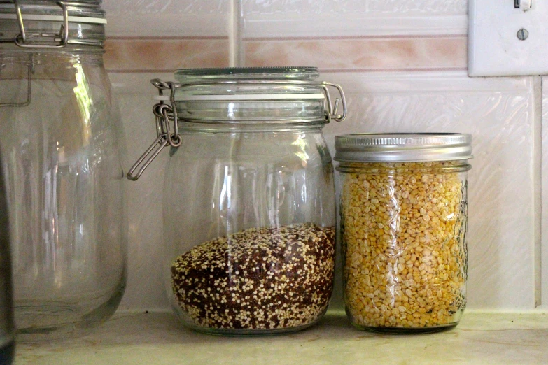 some jars of various types of food on a counter