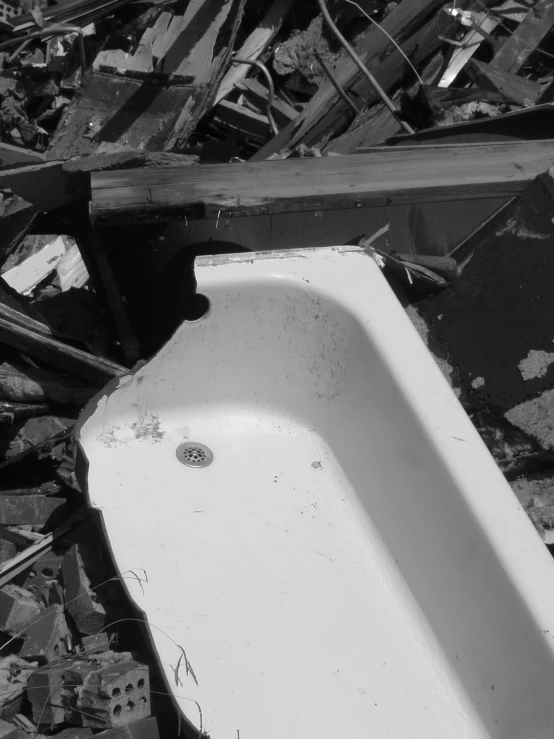 an old sink that is in the junkyard