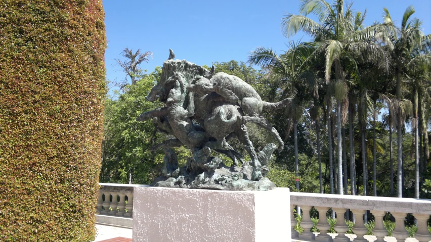 there is a statue of an elephant with birds on its back