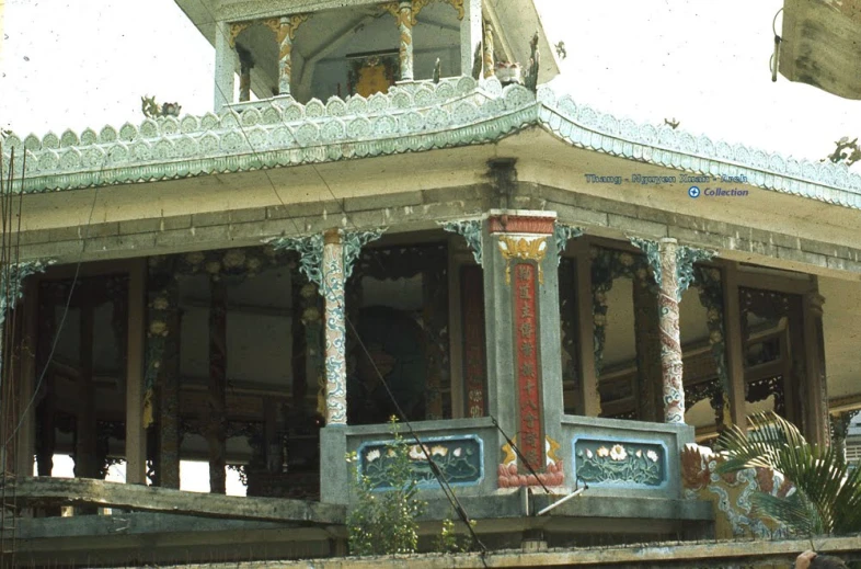 the porch of a building has decorative details on it