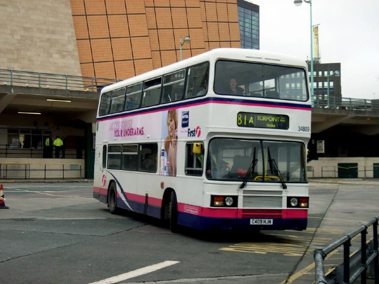 a double decker bus sitting on the road