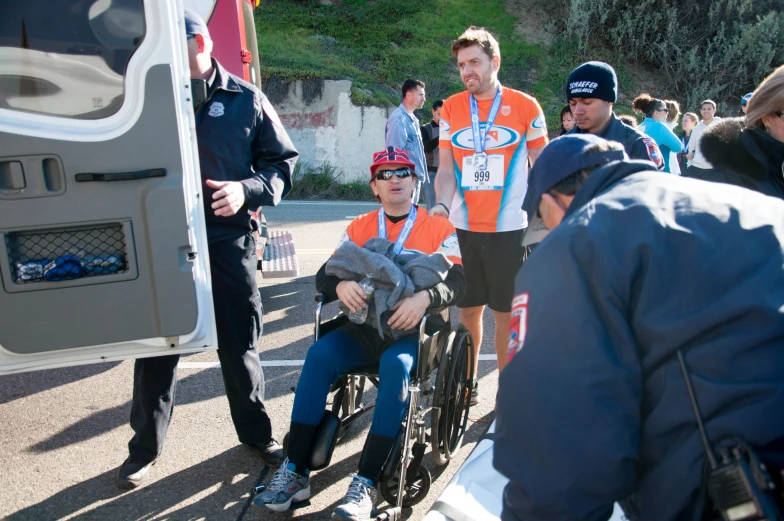 a person in a motorized bike and some people in the background