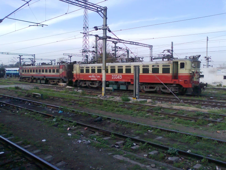 two trains are seen going down the tracks