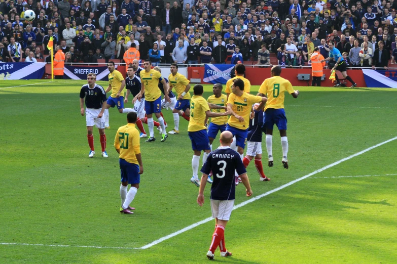 many soccer players are in a group on the field