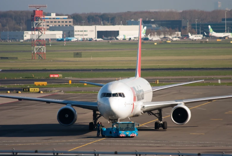 the large passenger airplane is waiting at the airport