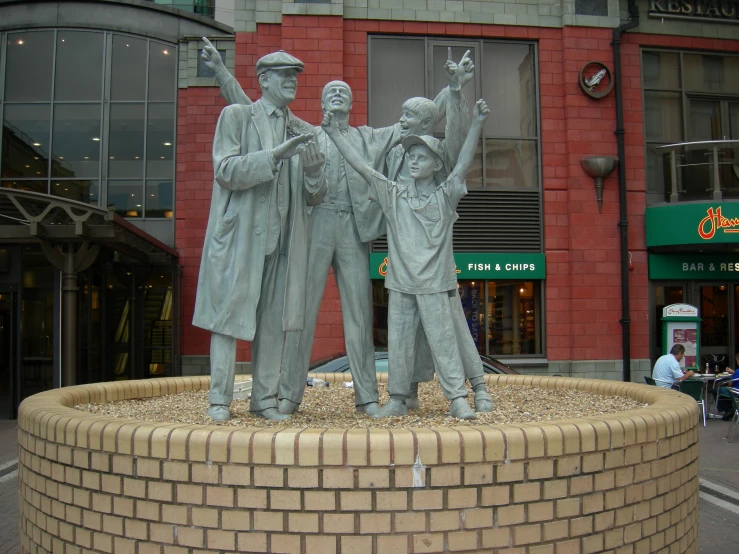 a statue of two people standing near one another