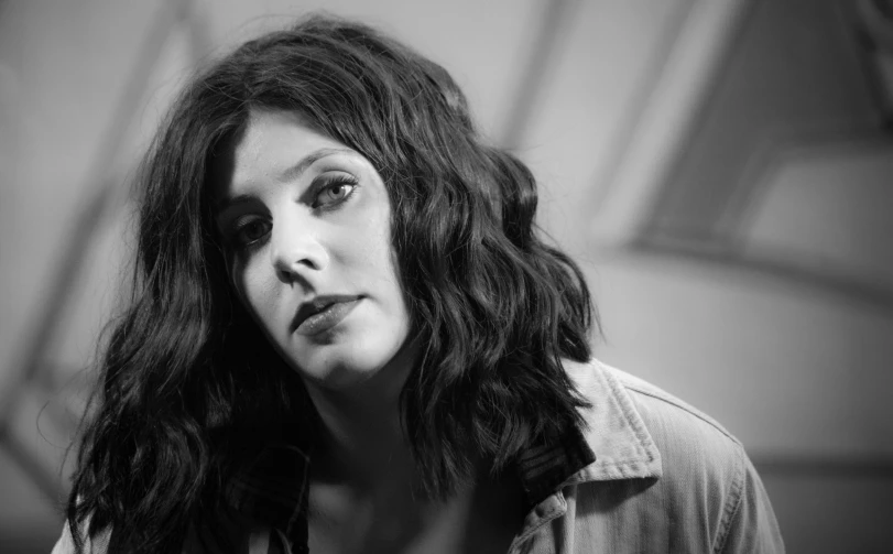 a woman with long hair looking away from the camera