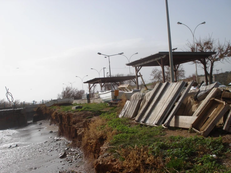 a sandy beach next to a bank that has been washed