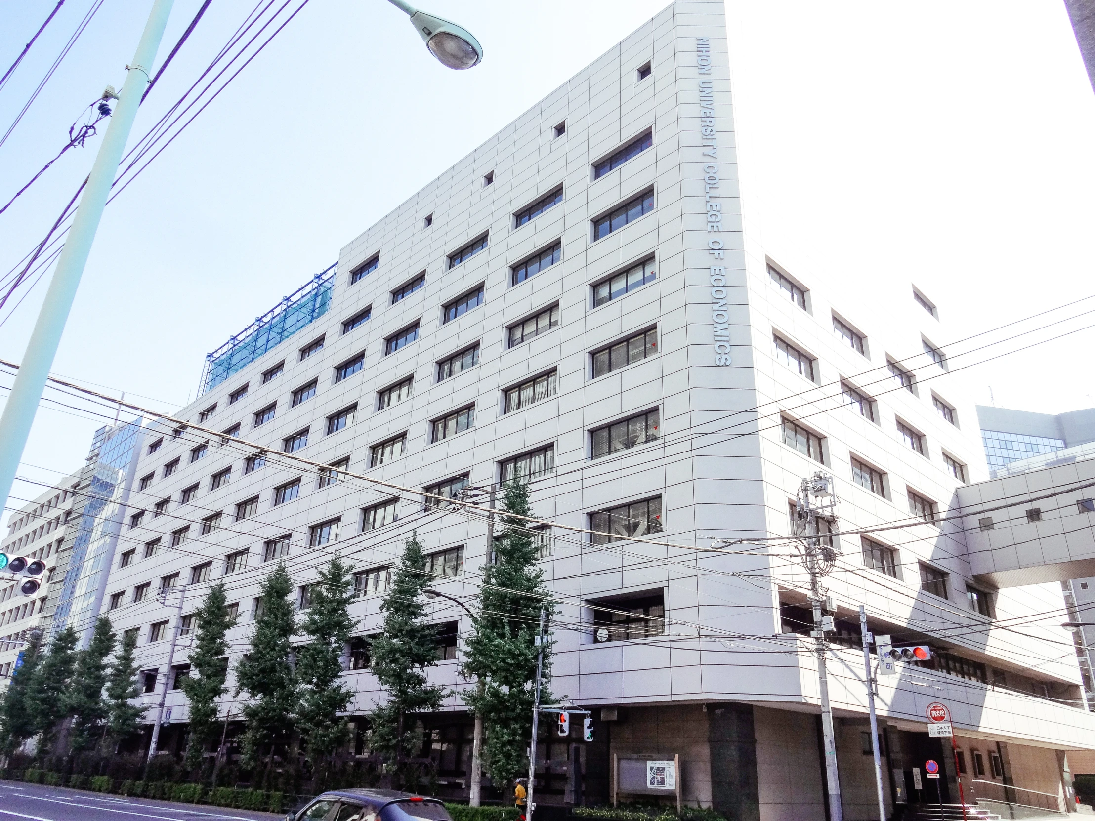 a large white building sitting next to a street