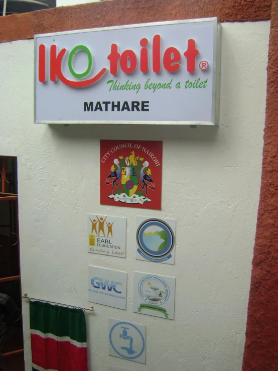 a sign with various stickers on it that say'i love toilet '