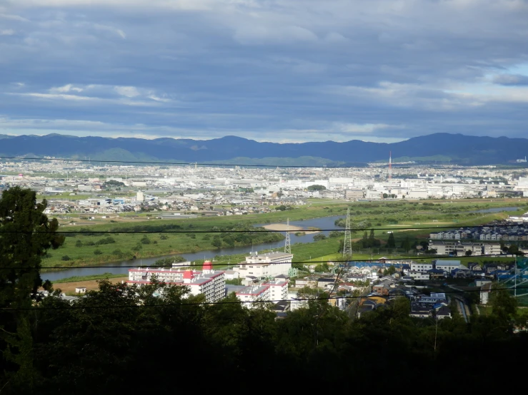 this is a cityscape taken from the top of a hill