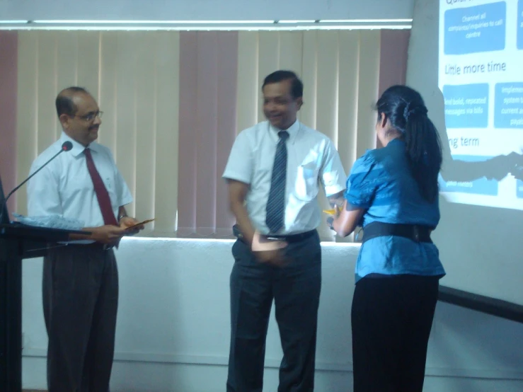 three business men standing next to each other