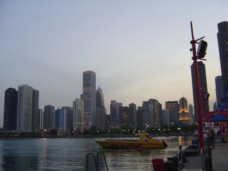 a boat is sitting on the river in front of a city