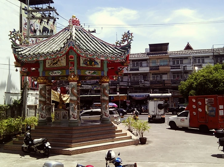 a large clock tower is surrounded by buildings