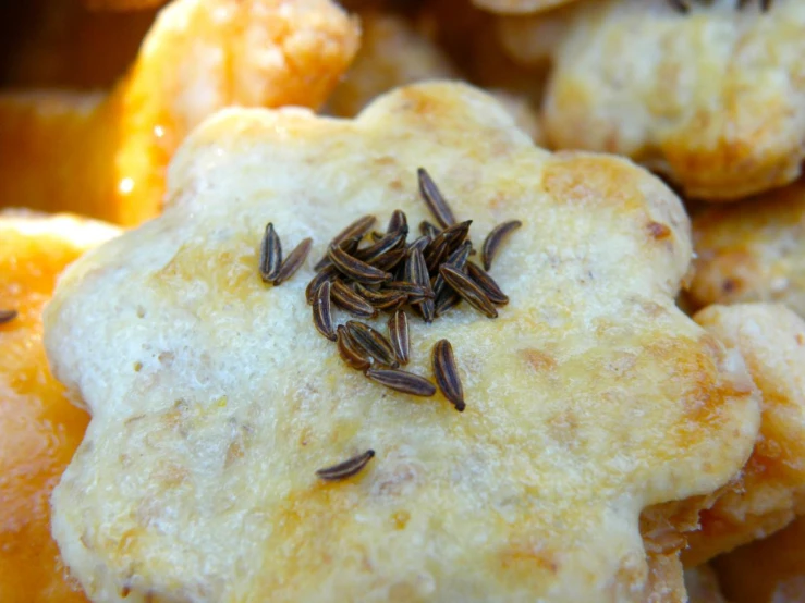 several cookies with orange zest on top