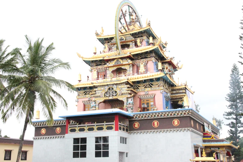 a tall tower with many clocks on the top of it