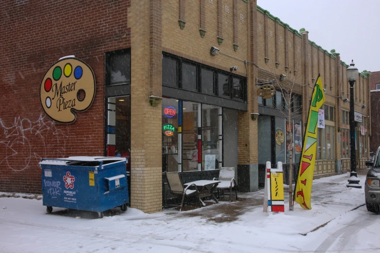 a shop with signage and ice, parked on the side walk