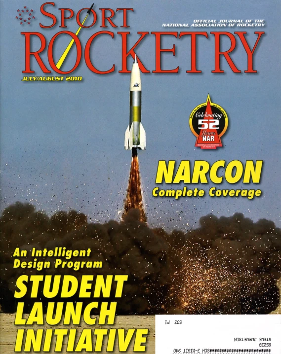 a magazine cover that has a rocket flying up