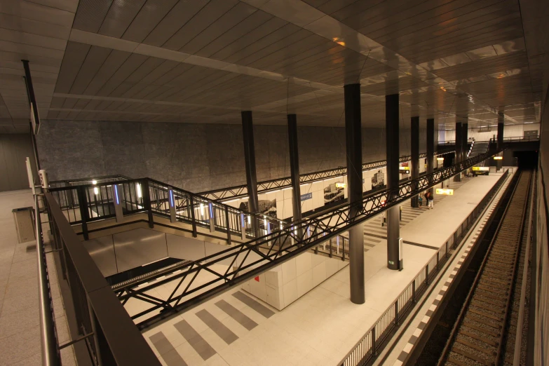 a large open air area with a balcony, and lots of stairs