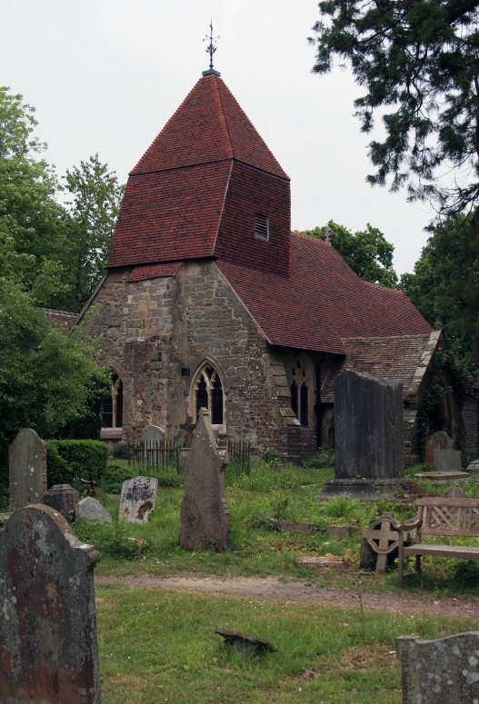 a stone church with a cross on the top