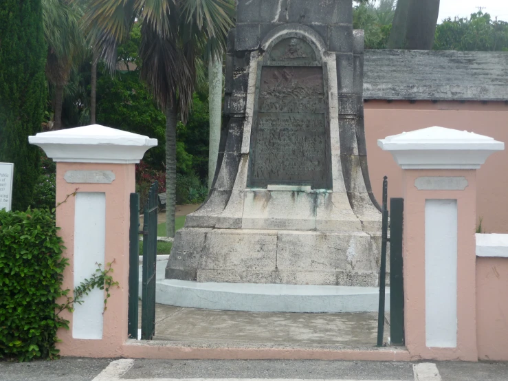 some type of gate with a statue near by