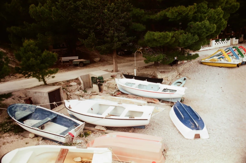 a row of boats next to a couple of houses