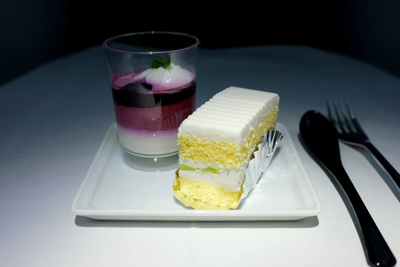 a small dessert on a white plate and fork