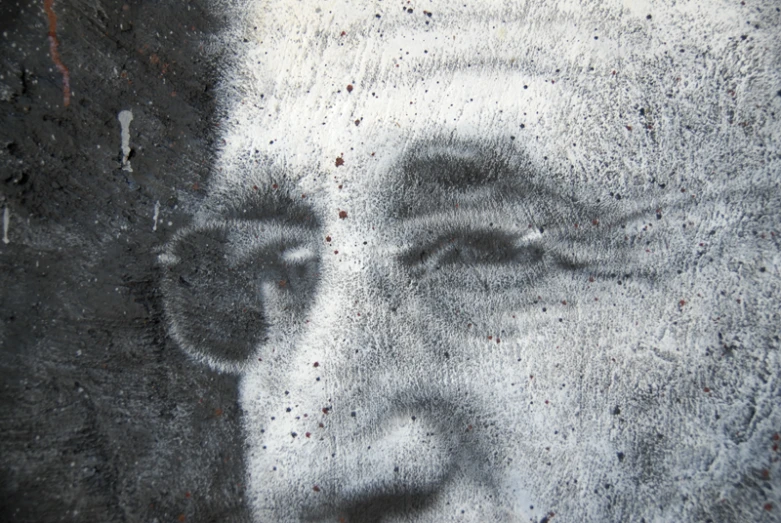 a blurry pograph of a man has faded eyes