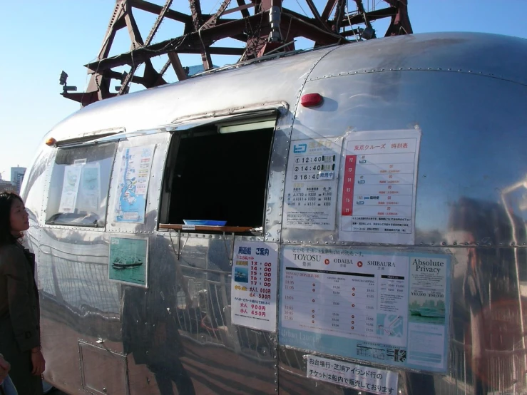 an older airplane is parked at a station