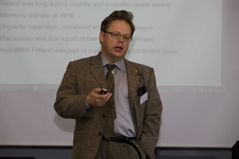 a man giving a presentation at the podium