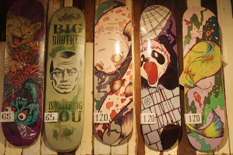 the five skateboards are all painted with different colors