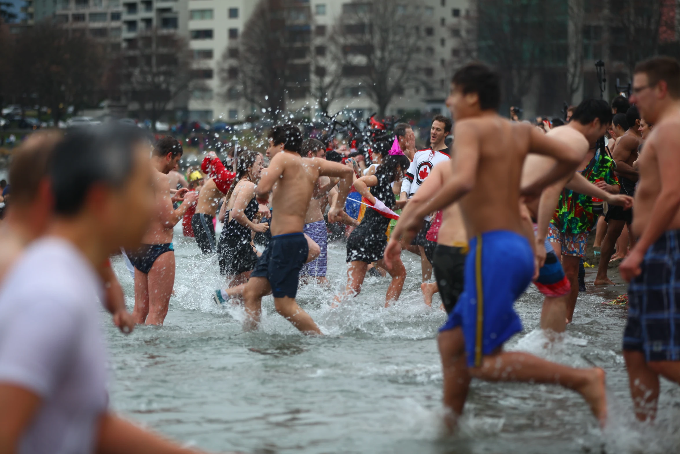 several people who are running in the water