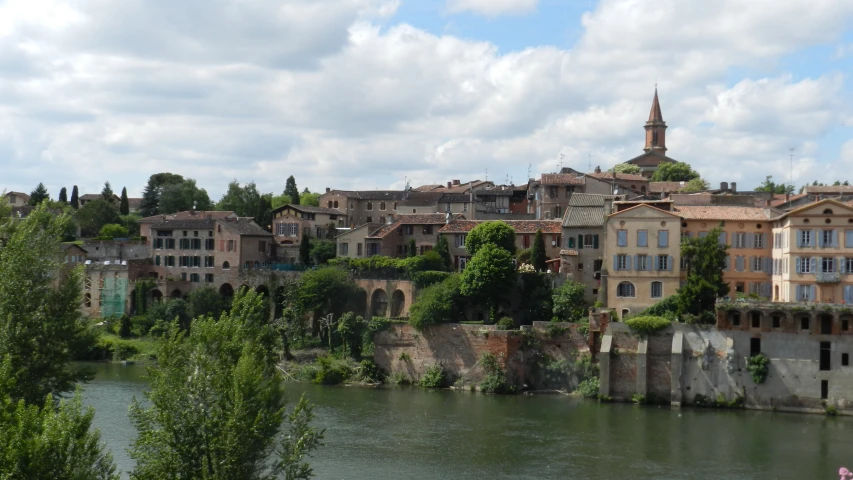 a town by the water has old houses near it