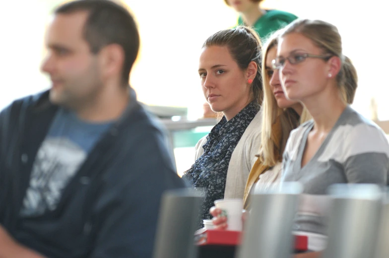 people sitting in a line and waiting for their turn