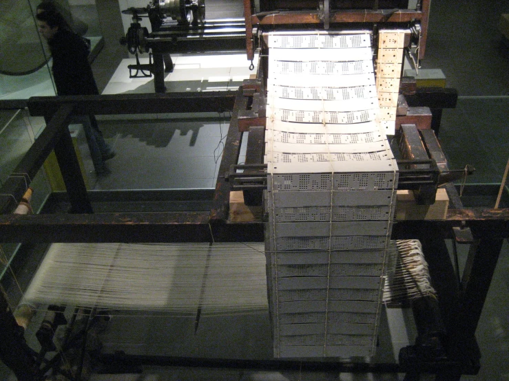 many rows of metal sheets on a long machine