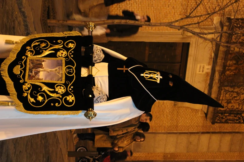 a nun is dressed in costume and is standing