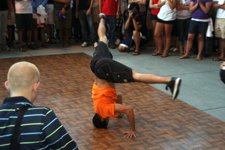 a person doing tricks in front of people