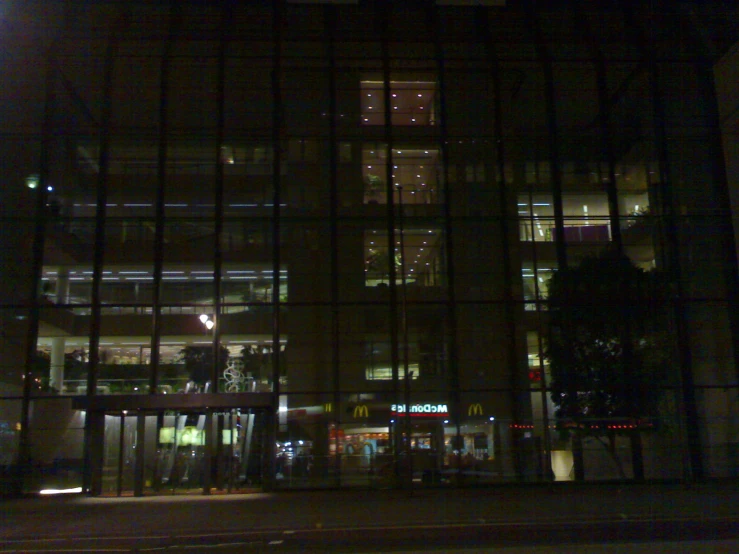 a building with some lights and windows is lit up at night