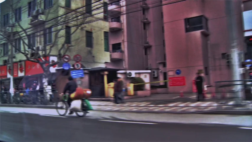 people are riding bicycles and talking on the side of a street