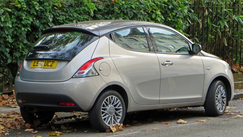 an image of a silver smart car parked by itself