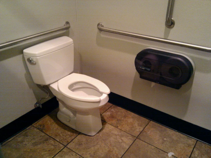 this is a white toilet in a public bathroom