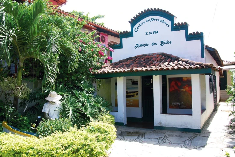 a building with a green and white roof