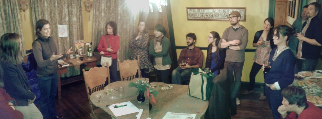 group of people sitting and standing in the corner of a room