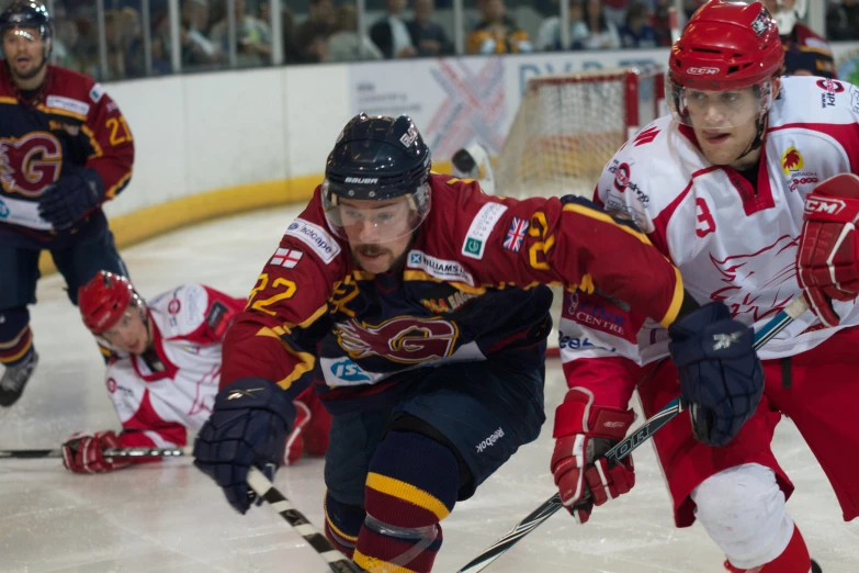 a hockey game with several players in action