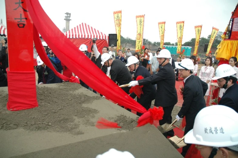 the men are making sand castles at the carnival