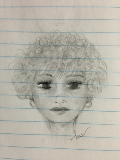 a drawing of a woman's face and hair is on paper