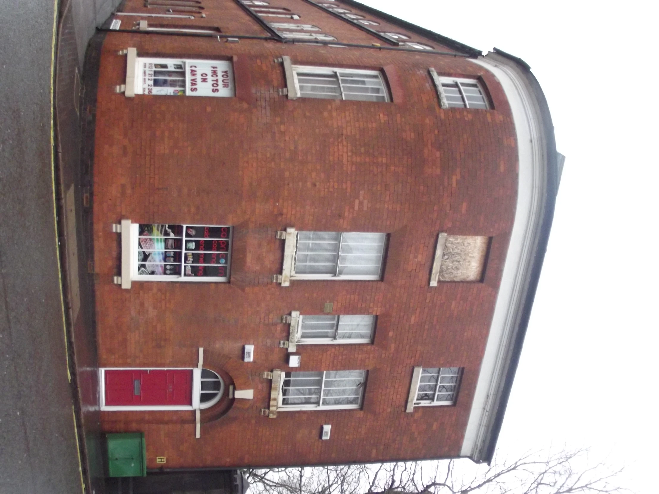 there is a red brick building on this street