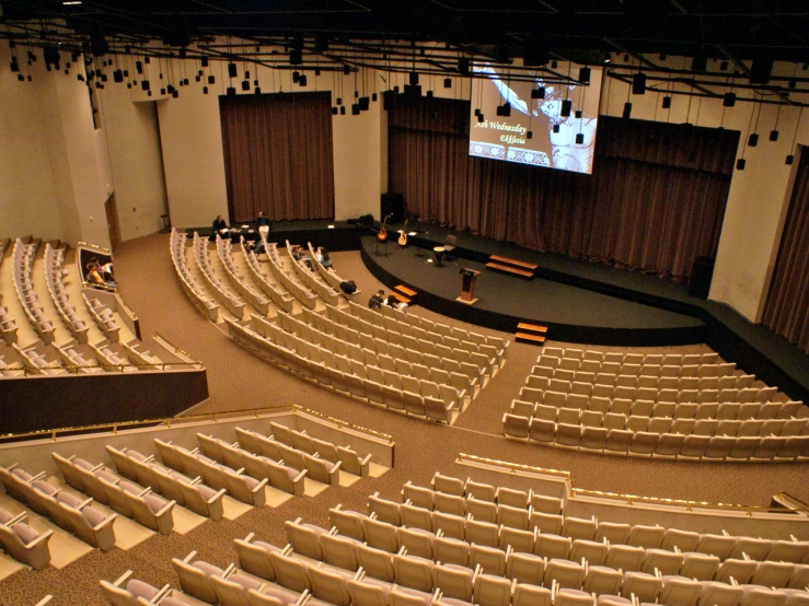 an empty auditorium is shown during a conference