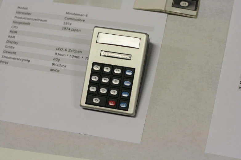 an old type calculator sitting on a table